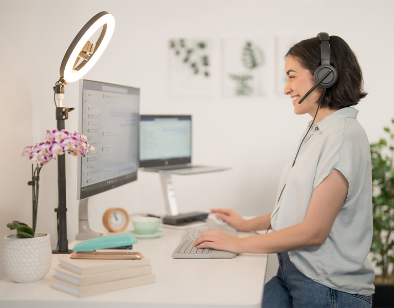 Woman with a Kensington headset responding to a customer